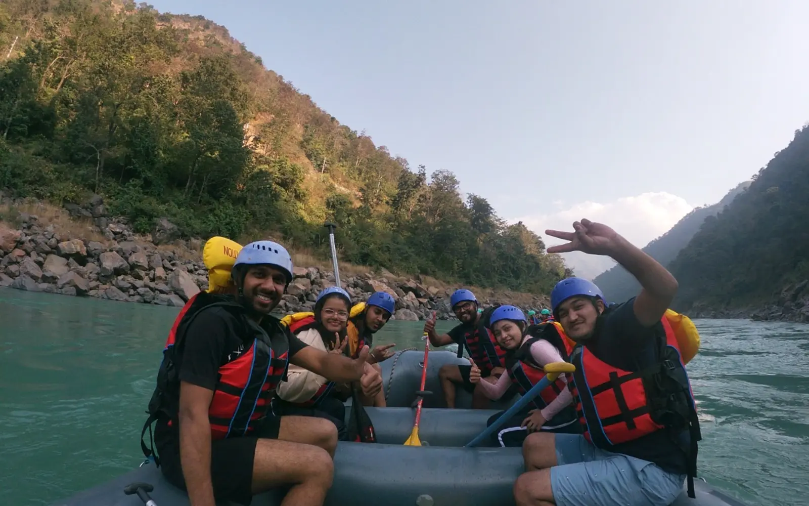 A group enjoying a guided rafting activity in Rishikesh